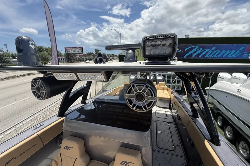Slide: The Image of 2007 Midnight Express 37 Open boat with advanced audio and lighting system, docked in Miami. - 16