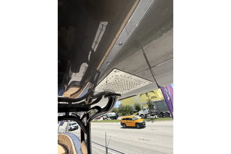 Slide: The Image of 2007 Midnight Express 37 Open boat detail with street view in background. - 20