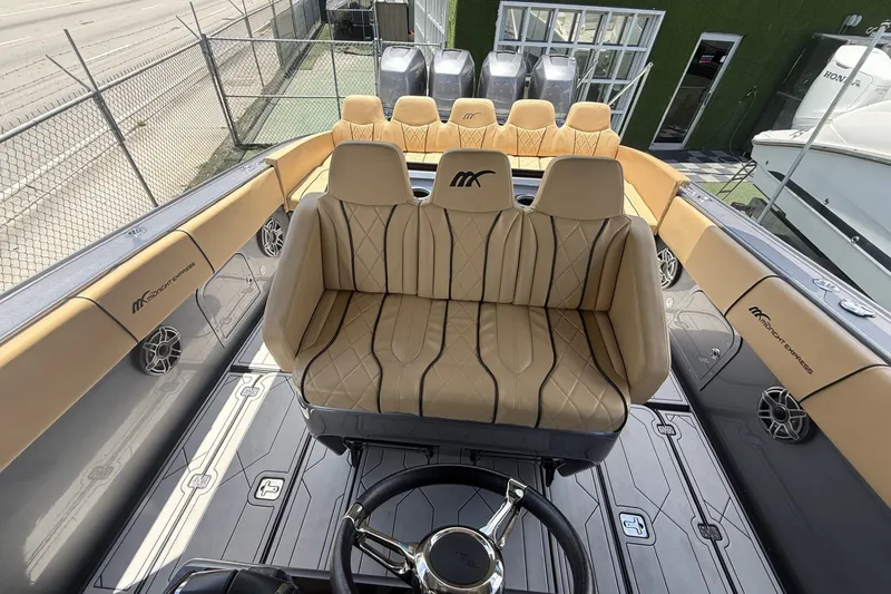 Slide: The Image of Luxurious interior of a 2007 Midnight Express 37 Open boat with tan seating. - 14
