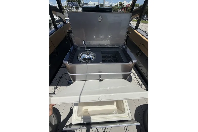 Slide: The Image of 2007 Midnight Express 37 Open boat with open storage compartment and sink. - 17