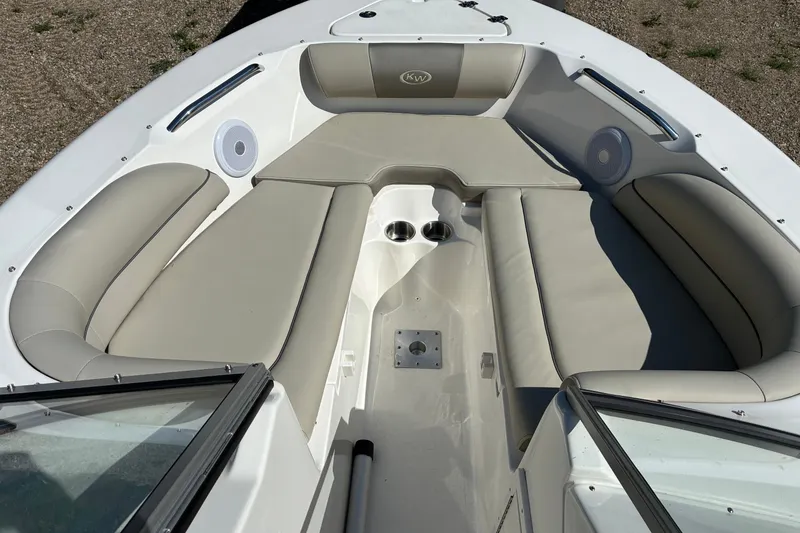 Slide: The Image of 2023 Key West 203 DFS boat interior with beige seating and cup holders. - 13