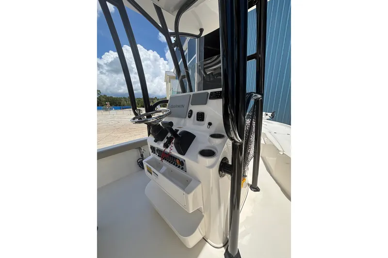 Slide: The Image of 2023 Key West 239 FS boat console with Garmin navigation system and steering wheel. - 10