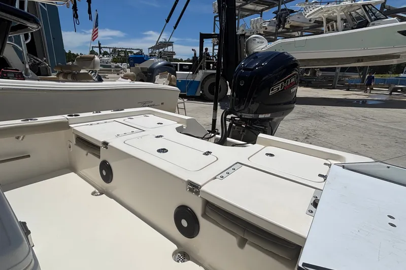 Slide: The Image of 2023 Key West 239 FS boat with Yamaha engine at a marina. - 4