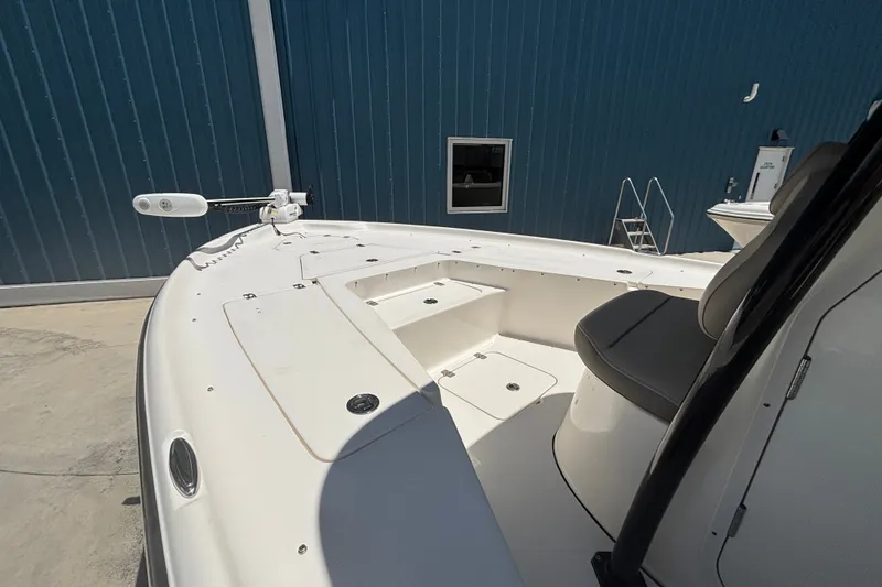 Slide: The Image of 2023 Key West 239 FS boat interior with seating and storage compartments. - 9