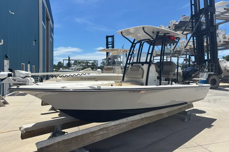 The Image of 2023 Key West 239 FS boat on display at a marina under clear blue skies. - 1