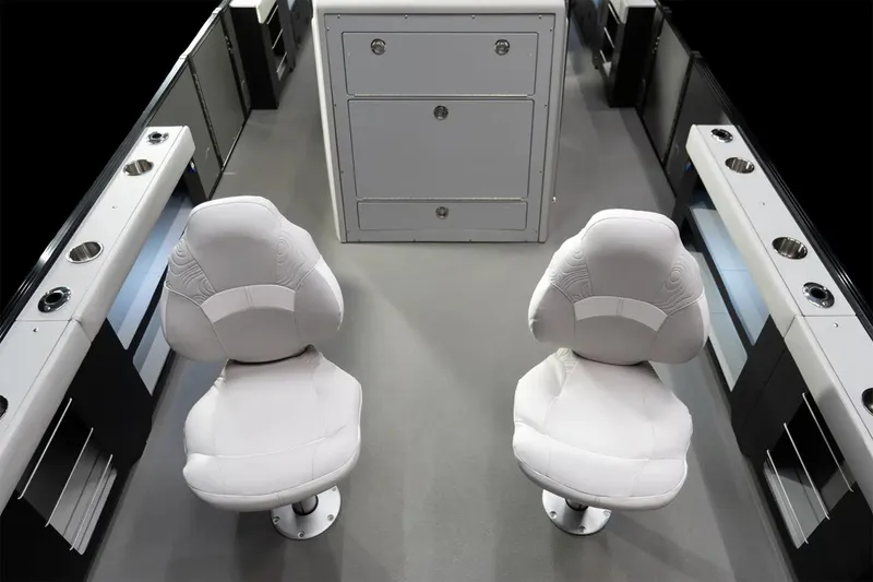 Slide: The Image of Manufacturer Provided Image: 2025 Tahoe Pontoon Geofish CLX interior with two white captain chairs and storage unit. - 3