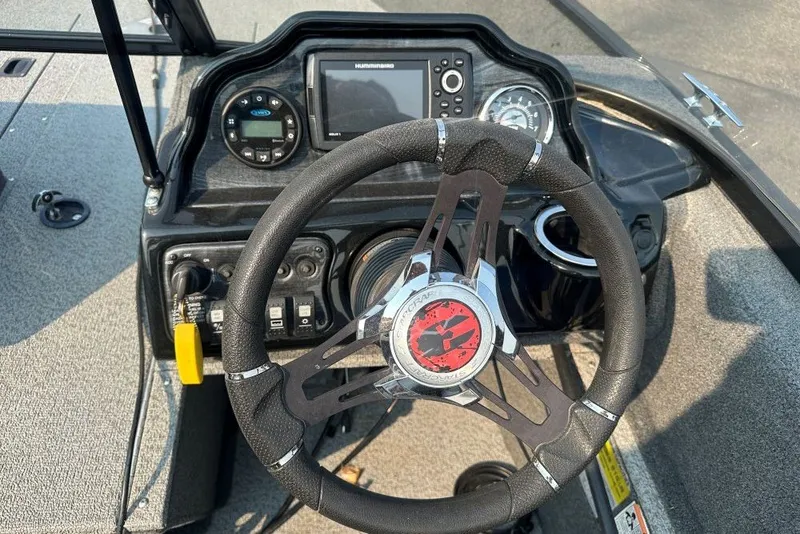 Slide: The Image of Steering console of 2021 Starweld Fusion 16 DC boat with navigation controls. - 5