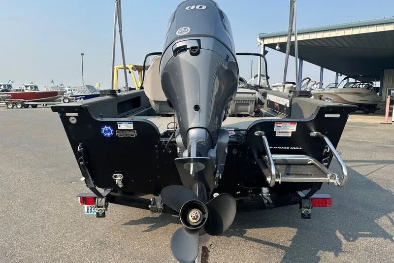 Slide: The Image of Rear view of a 2021 Starweld Fusion 16 DC boat with a 90 HP engine. - 3