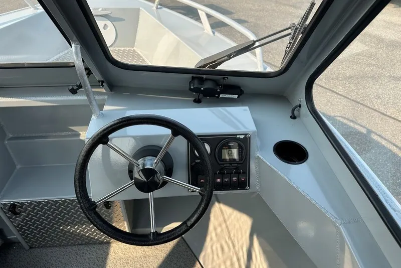 Slide: The Image of 2018 Hewescraft 160 Sportsman boat interior with steering wheel and control panel. - 5