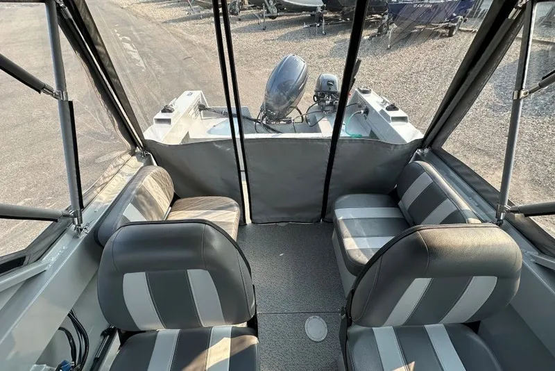 Slide: The Image of 2018 Hewescraft 160 Sportsman boat interior with seating and outboard motor. - 7