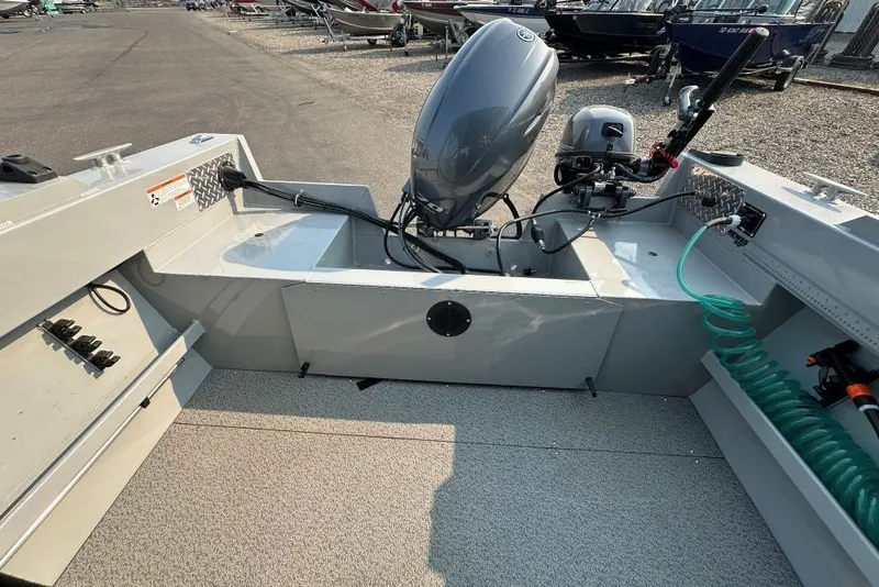 Slide: The Image of 2018 Hewescraft 160 Sportsman boat interior with motor and equipment. - 8