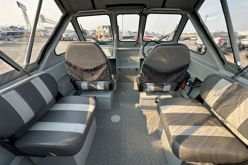 Slide: The Image of Interior of 2018 Hewescraft 160 Sportsman boat with seating and steering wheel. - 4