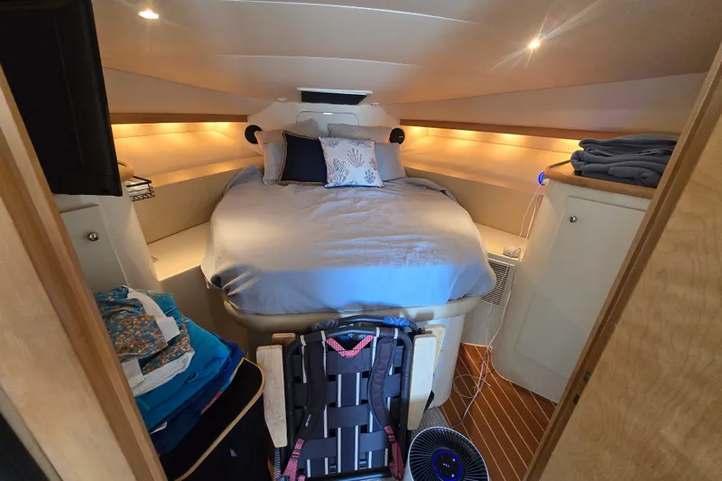 Slide: The Image of Cozy cabin interior of 1996 Carver 380 Santego yacht with bed and ambient lighting. - 17