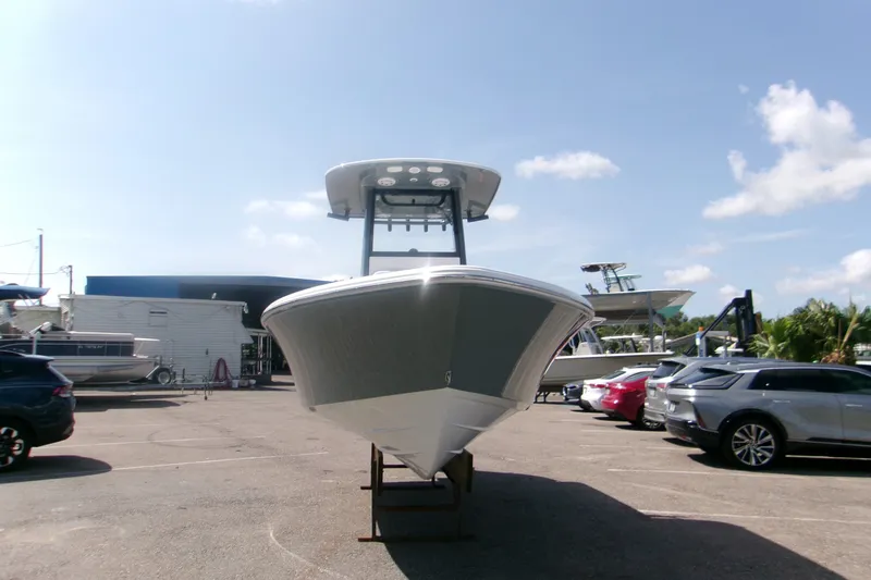 Slide: The Image of 2027 Sportsman Masters 227 Bay Boat displayed in a sunny marina setting. - 14