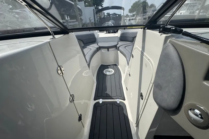 Slide: The Image of Interior view of 2022 Stingray 214 LR boat, featuring sleek seating and modern design. - 17