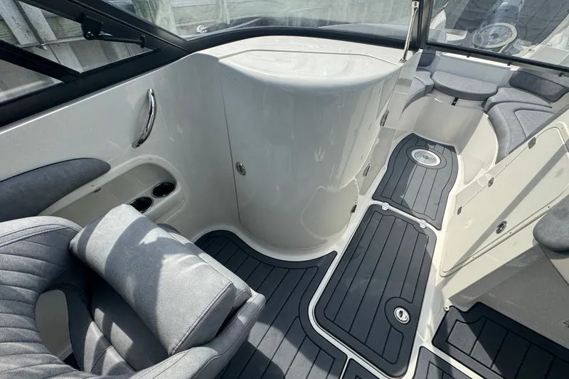 Slide: The Image of 2022 Stingray 214 LR boat interior with sleek seating and modern design. - 15