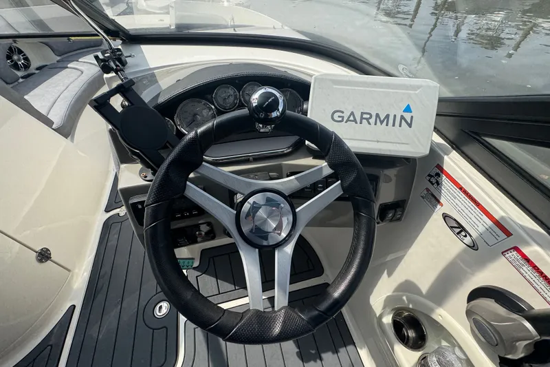 Slide: The Image of Steering wheel and dashboard of 2022 Stingray 214 LR boat with Garmin navigation system. - 8