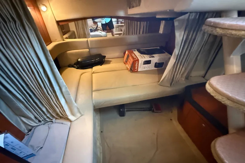 Slide: The Image of Interior of 2007 Sea Ray 340 Sundancer with beige seating and a Lasko box. - 15
