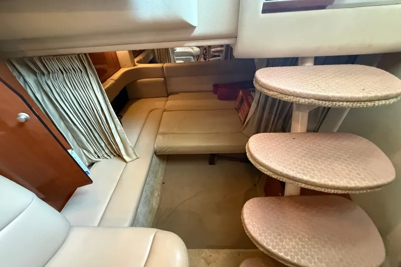 Slide: The Image of Interior of 2007 Sea Ray 340 Sundancer with beige seating and curved stairs. - 13