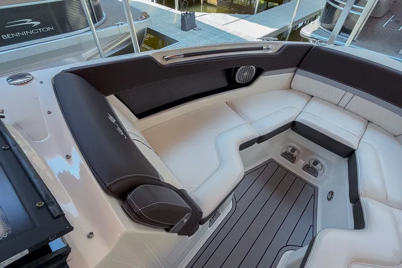Slide: The Image of Luxurious seating area on a 2017 Sea Ray SLX 250 boat, featuring elegant upholstery. - 14