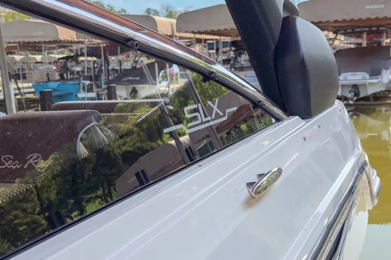 Slide: The Image of 2017 Sea Ray SLX 250 boat close-up, showcasing sleek design and branding. - 16