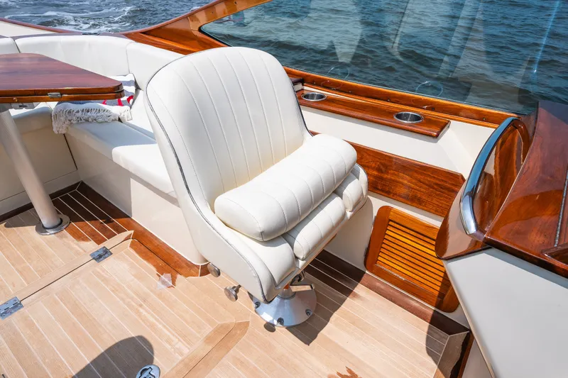 Slide: The Image of Luxurious interior of 2008 Hinckley Talaria 29R boat with elegant seating and wood accents. - 30