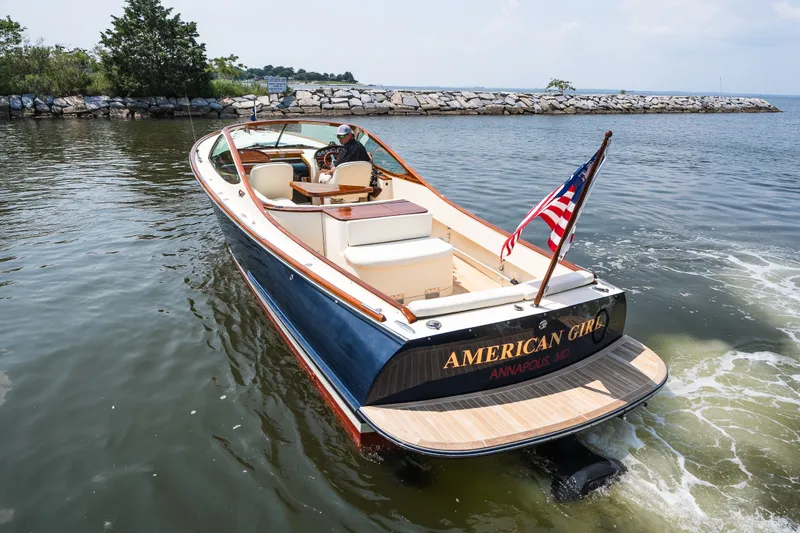 Slide: The Image of 2008 Hinckley Talaria 29R boat cruising in Annapolis, Maryland waters with American flag. - 15