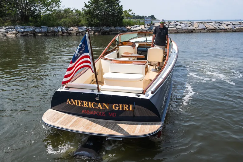Slide: The Image of 2008 Hinckley Talaria 29R boat named "American Girl" in Annapolis, MD, with American flag. - 17