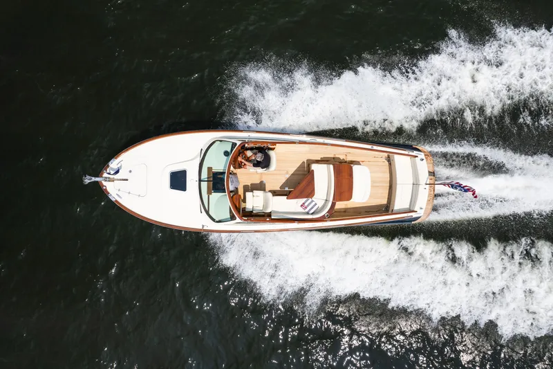 Slide: The Image of Aerial view of 2008 Hinckley Talaria 29R yacht cruising on water. - 7