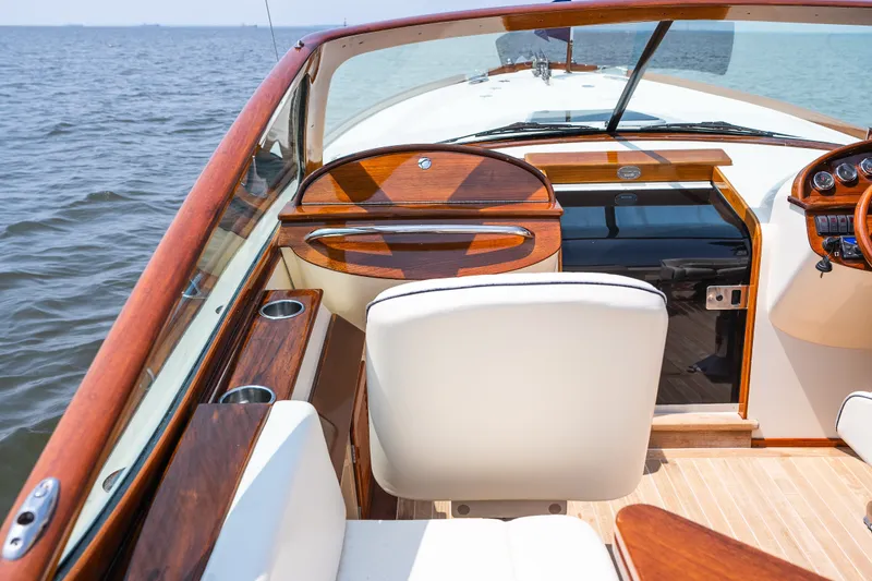 Slide: The Image of 2008 Hinckley Talaria 29R boat interior with elegant wood finish and ocean view. - 19