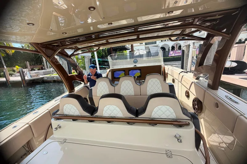 Slide: The Image of 2019 Midnight Express 43 Open boat interior with luxury seating and modern dashboard. - 5