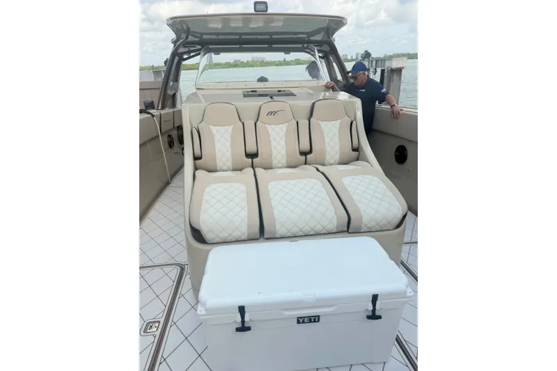 Slide: The Image of Luxurious seating on 2019 Midnight Express 43 Open boat with Yeti cooler. - 7