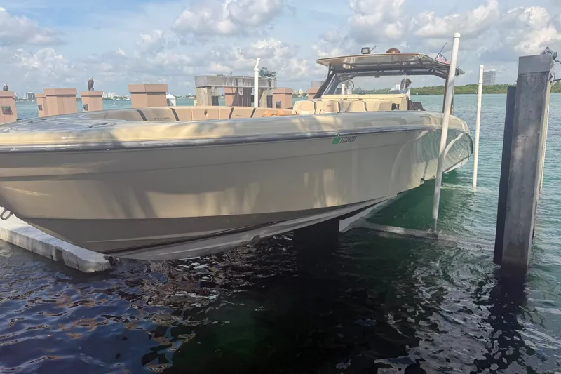 The Image of 2019 Midnight Express 43 Open boat docked on a sunny day. - 1