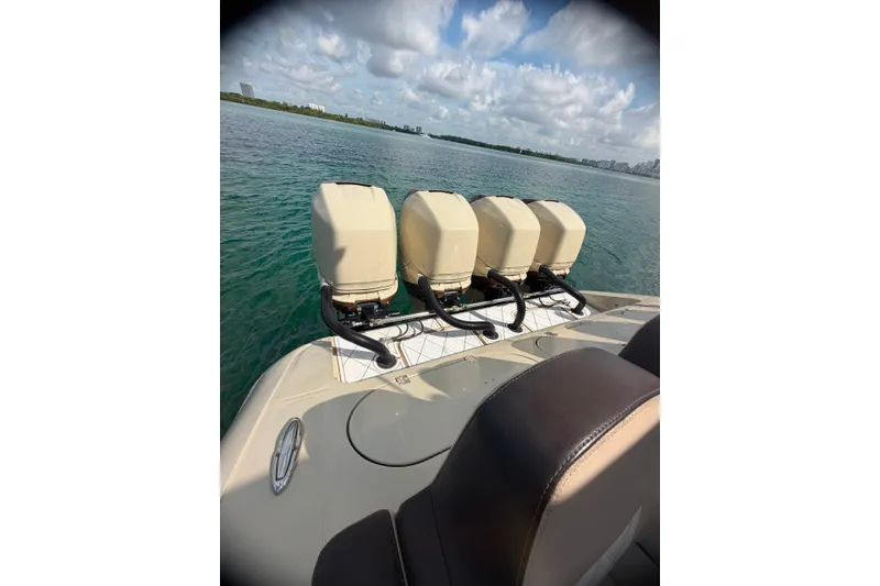 Slide: The Image of 2019 Midnight Express 43 Open boat with four outboard engines on a sunny day. - 4