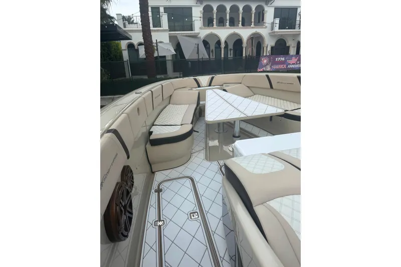 Slide: The Image of Luxurious seating area on a 2019 Midnight Express 43 Open boat, featuring elegant upholstery and modern design. - 10