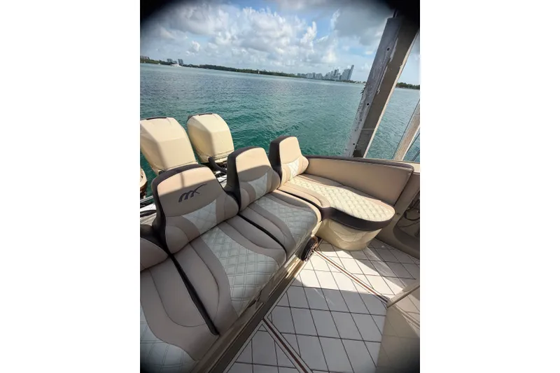 Slide: The Image of Luxurious seating on a 2019 Midnight Express 43 Open boat with scenic ocean view. - 3