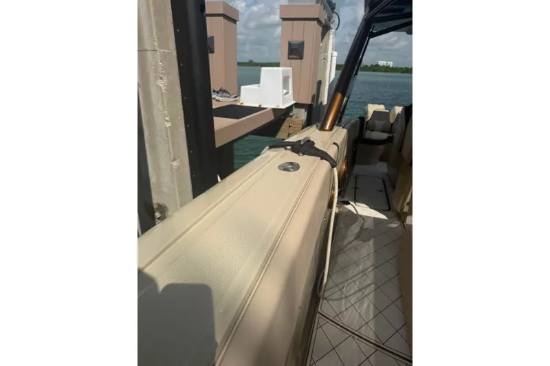 Slide: The Image of 2019 Midnight Express 43 Open boat docked, showcasing sleek design and luxurious interior. - 8