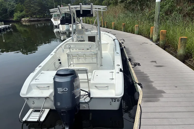Slide: The Image of 2004 Sea Pro 206 Center Console boat docked with Yamaha 150 engine. - 3