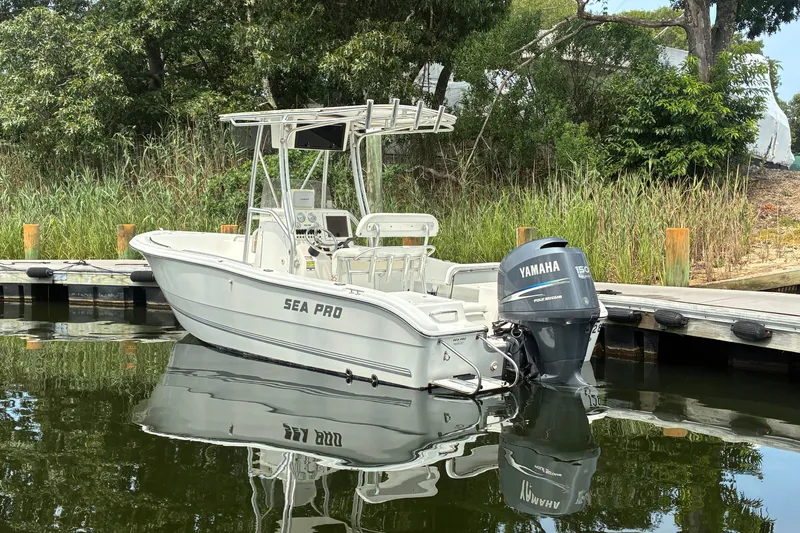 Slide: The Image of 2004 Sea Pro 206 Center Console boat docked with Yamaha outboard motor. - 1