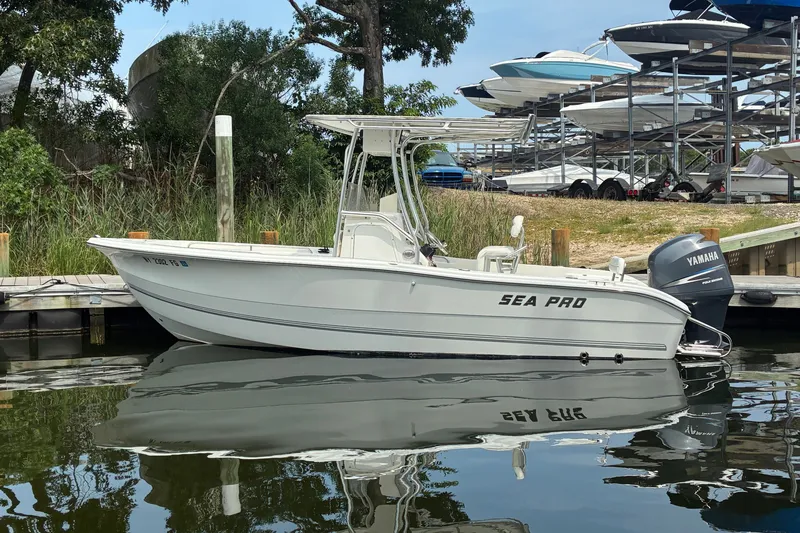 The Image of 2004 Sea Pro 206 Center Console boat docked with Yamaha outboard motor. - 0