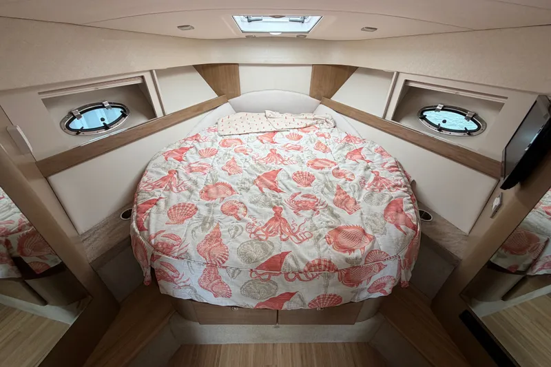 Slide: The Image of Cozy cabin interior of 2016 Formula 37 Performance Cruiser with seashell-patterned bedding. - 23