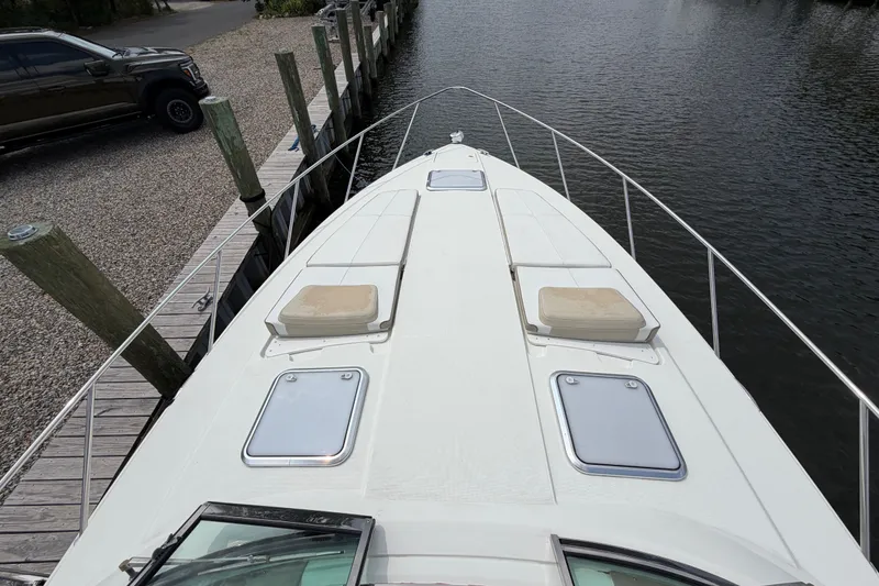 Slide: The Image of 2016 Formula 37 Performance Cruiser docked, showcasing spacious deck and sleek design. - 38