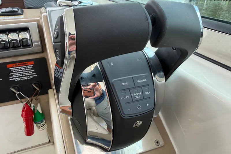 Slide: The Image of Throttle controls of a 2016 Formula 37 Performance Cruiser boat. - 16