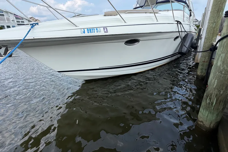 Slide: The Image of 2016 Formula 37 Performance Cruiser docked on calm water. - 49