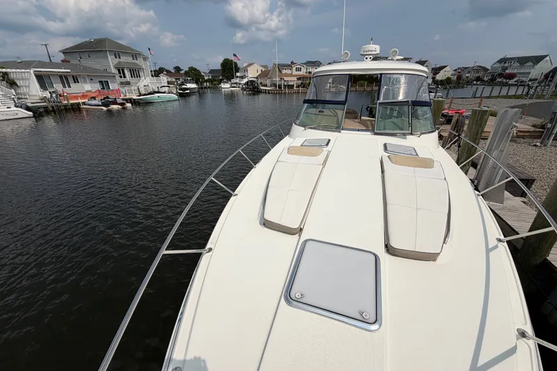 Slide: The Image of 2016 Formula 37 Performance Cruiser docked in a serene marina setting. - 41