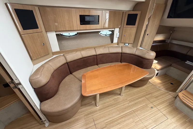 Slide: The Image of Interior of 2016 Formula 37 Performance Cruiser with curved seating and wooden table. - 20