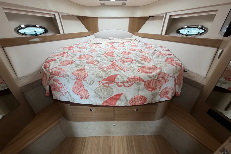 Slide: The Image of Cozy cabin interior of 2016 Formula 37 Performance Cruiser with seashell-patterned bedding. - 24