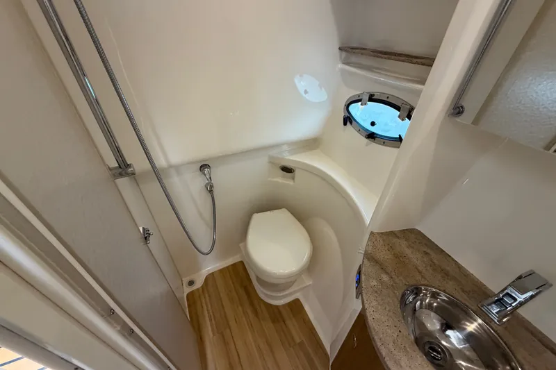 Slide: The Image of 2016 Formula 37 Performance Cruiser bathroom with shower, toilet, and sink. - 29