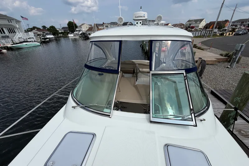 Slide: The Image of 2016 Formula 37 Performance Cruiser docked at a marina, featuring a sleek design. - 39