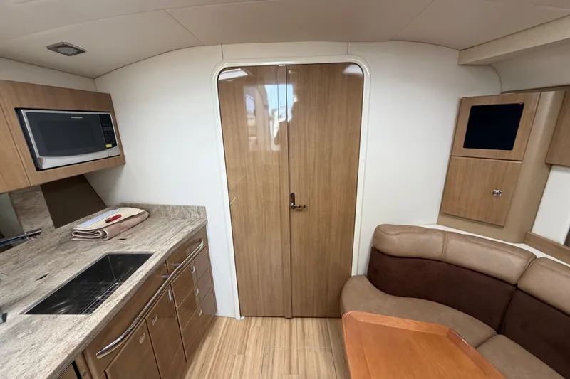 Slide: The Image of Interior of 2016 Formula 37 Performance Cruiser with modern kitchen and seating area. - 22